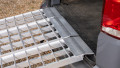 close up of the rest end connection of an extra wide bike ramps kit resting on a vehicle 