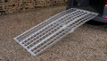 extra wide loading ramps resting on car