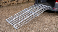 extra wide bike ramps kit resting on a vehicle 
