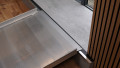 wheelchair ramp resting on step, close up of rest on connection and surface