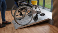 economy folding wheelchair ramp in use with assisted manual wheelchair