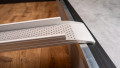 Low Profile Edge Channel Ramps folding resting on a step used for a wheelchair or mobility scooter