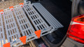 Rollable ramp testing on the boot of a car, close up image of the rest on connection