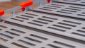 Close up of surface on a step of a portable roll up aluminium wheelchair ramp