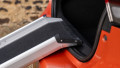 Telescopic dog ramp resting on the boot of a car showing a close up of the rest on connection