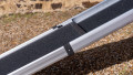 Telescopic dog ramp resting on the boot of a car, close up of the grip surface