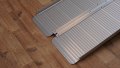 base of folding wheelchair ramp 