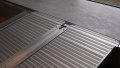 Aluminium wheelchair ramp with anti-slip surface