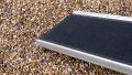 Lightweight telescopic dog ramp, close up of the foot end on a gravel floor
