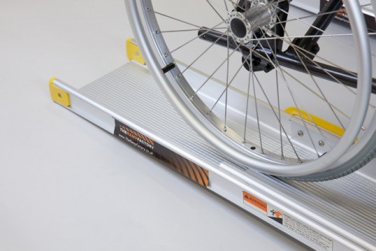 Wheelchair wheel on channel ramp 