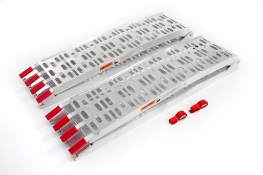 Motorcycle loading ramps folded on white surface
