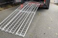 Loading ramps with red strap