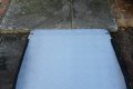 Adjustable threshold ramp next to step 