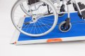 Wheelchair on premium folding wheelchair ramp 