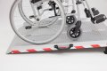 Wheelchair on extra wide folding wheelchair ramp