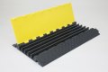 Black and yellow heavy duty cable protector 