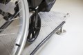 Wheelchair wheels on adjustable threshold ramp 