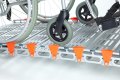 Manual wheelchair on the aluminium rollable ramp