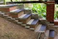 Black stair treads on concrete steps 