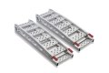 Pair of aluminium lightweight motorcycle ramps folded up on a white background