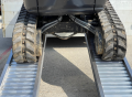 Digger driving up ramps 
