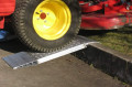 Aluminium container ramp resting on kerb