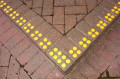 Yellow discs on pavement