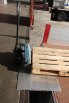 Heavy duty loading bridge with pallet truck 