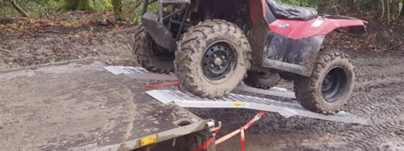 quad bike riding up bike ramps