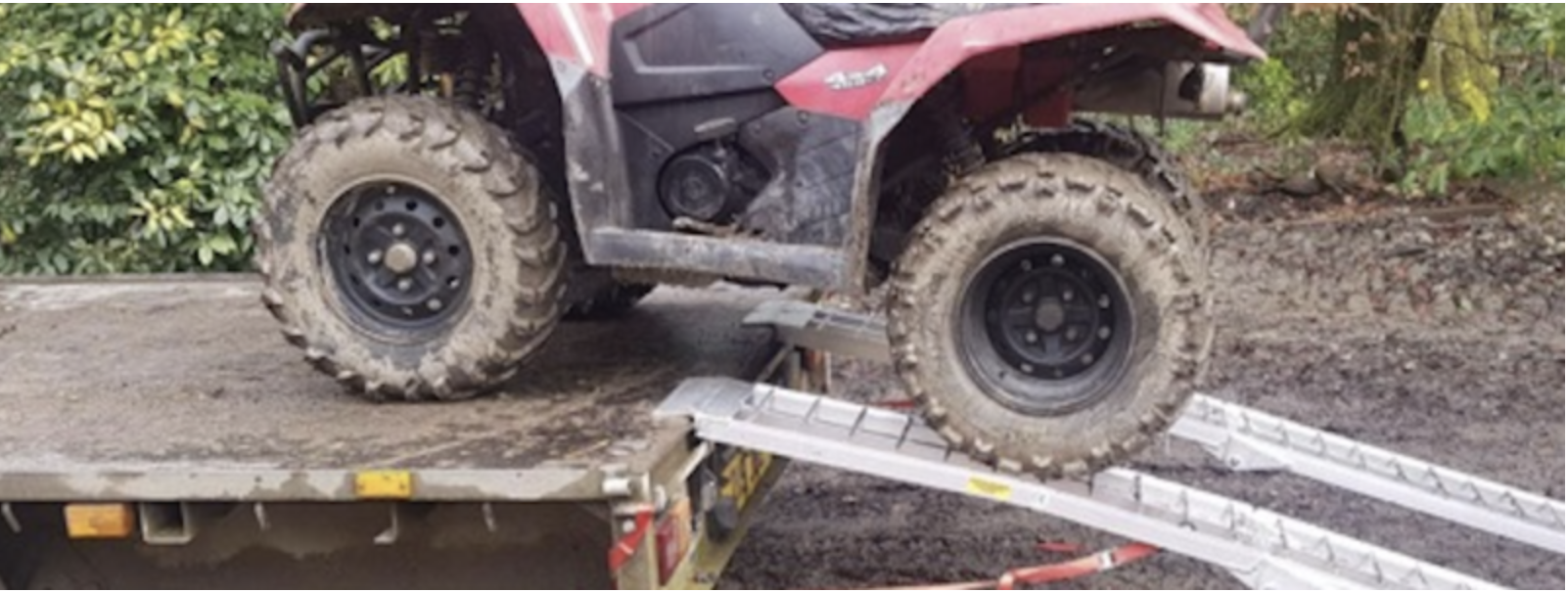 quad bike riding up bike ramps