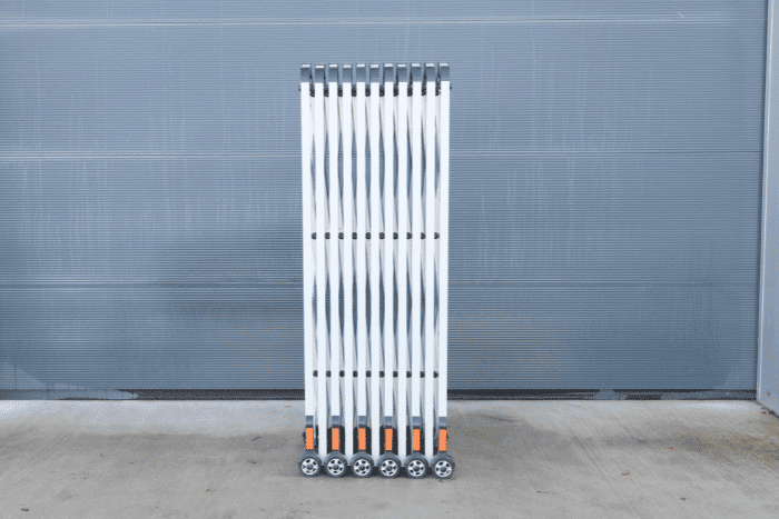 stored expandable barrier in front of warehouse