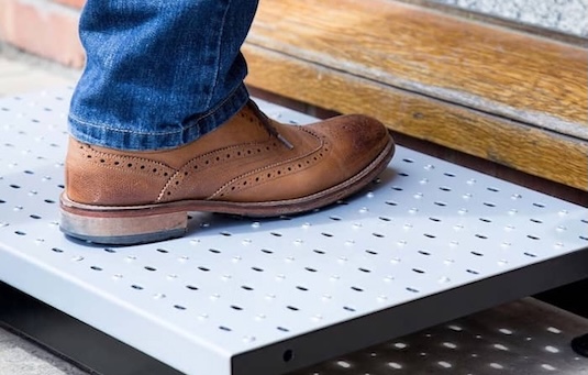 Half step infront of doorway Half step infront of doorway Full width anti-slip surface with drainage