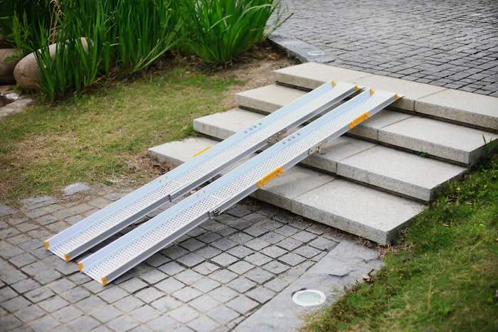 Wheelchair ramps overcoming steps