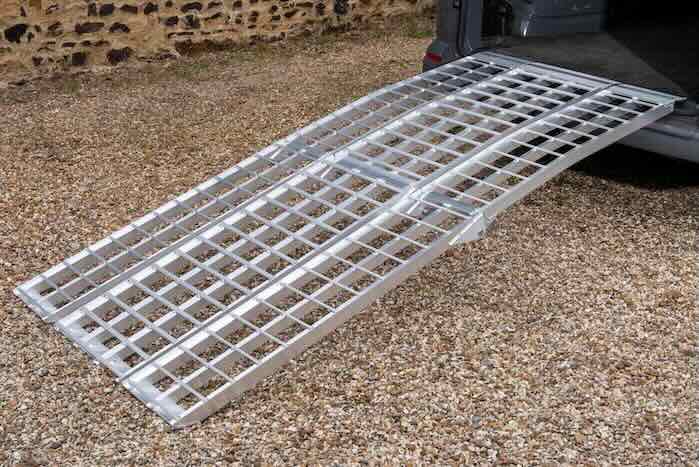 Wide motorcycle ramp kit resting on van 