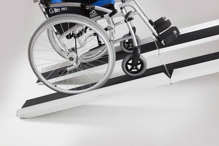 Pair of mobility scooter loading ramps in use Pair of mobility scooter loading ramps in use