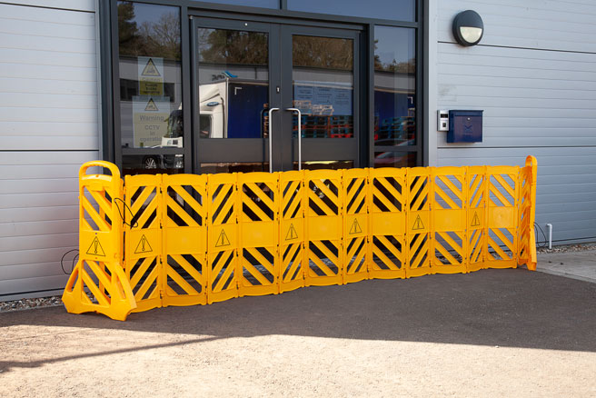 Retractable plasic barrier outside office 