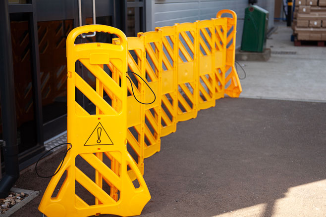 Retractable plasic barrier outside office 