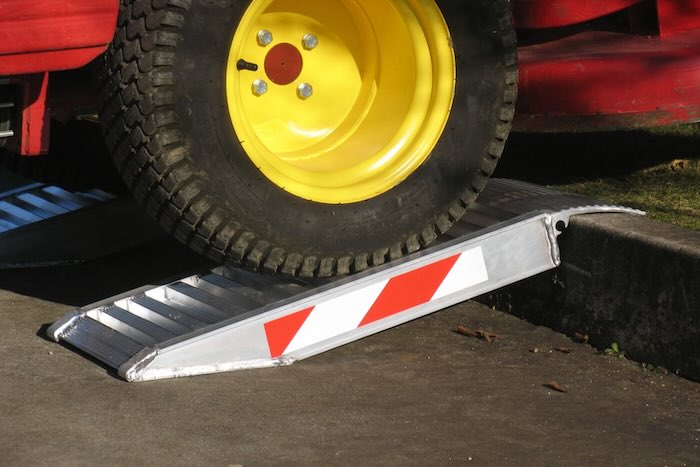 Container ramp resting on step 