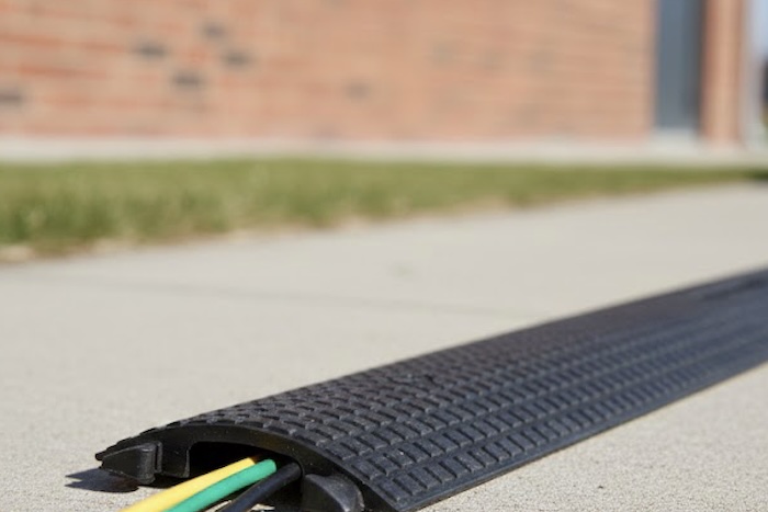 Cable cover on pavement