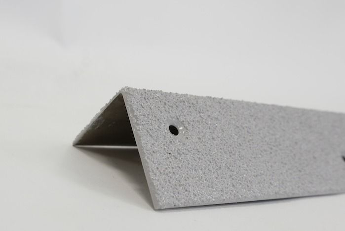 Grey stair tread with pre-drilled fixing points 