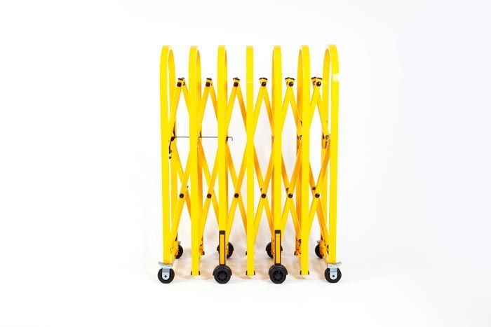 Yellow heavy duty expandable safety barrier on wheels Yellow heavy duty expandable safety barrier on wheels