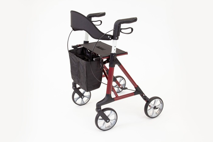 Red aluminium 4 wheeled rollator with seat, bag and backrest