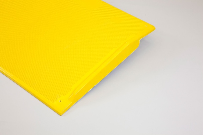 Portable yellow kerb ramp with edges Portable yellow kerb ramp with edges