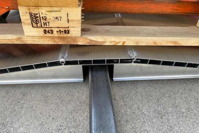 Pallet truck on bridge ramp 