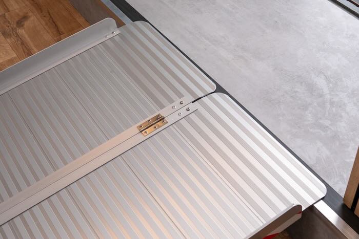 Wheelchair ramp resting on a step