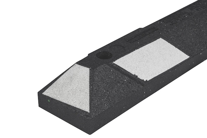 White and black park it wheel stop with fixing points White and black park it wheel stop with fixing points