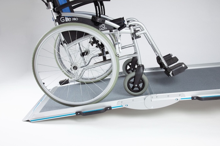 Aerolight Broadfold wheeelchair ramp with wheelchair going up the ramp 