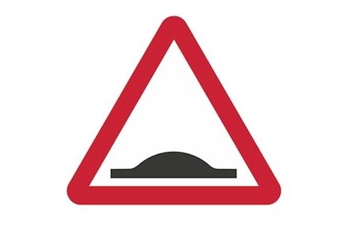 Speed bump warning sign