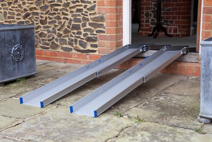 Multipurpose wheelchair ramps bridging door threshold 