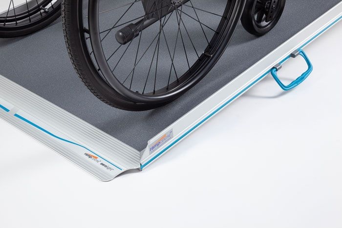 Wheelchair going up wheelchair ramp Wheelchair going up wheelchair ramp